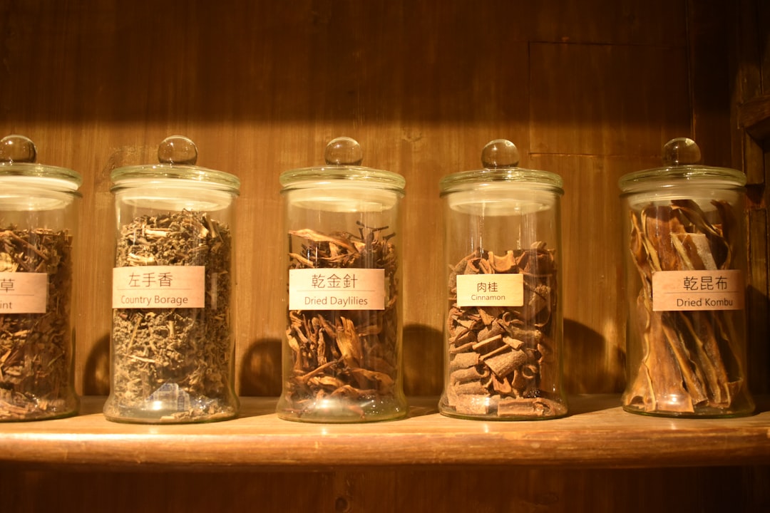 Dried herbs in jars used in cross-border herbal manufacturing