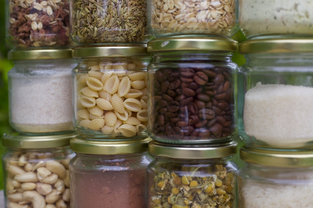 Bulk dried botanicals in glass jars ready for herbal contract manufacturing