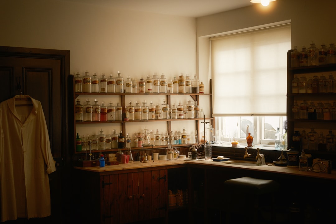 Laboratory shelving with botanical extract bottles used for microbial limits testing