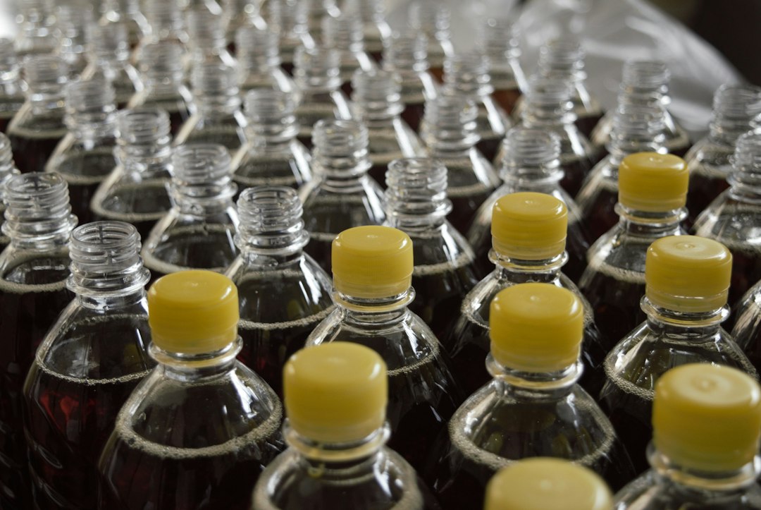 Filled bottles on a line, the core step in herbal beverage contract manufacturing