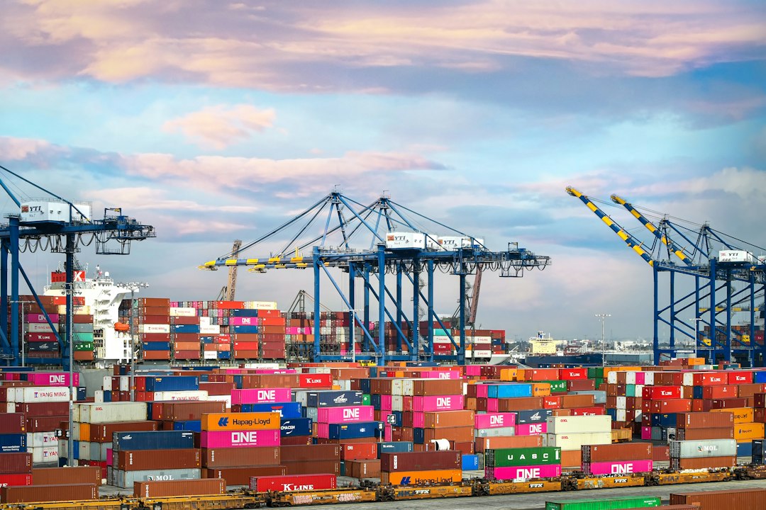 Cargo containers at port, representing imported sourcing versus north american herbal extract suppliers
