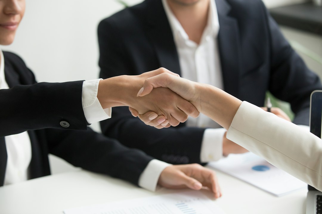 Brand owner agreeing a herbal product distribution deal with a Canadian buyer