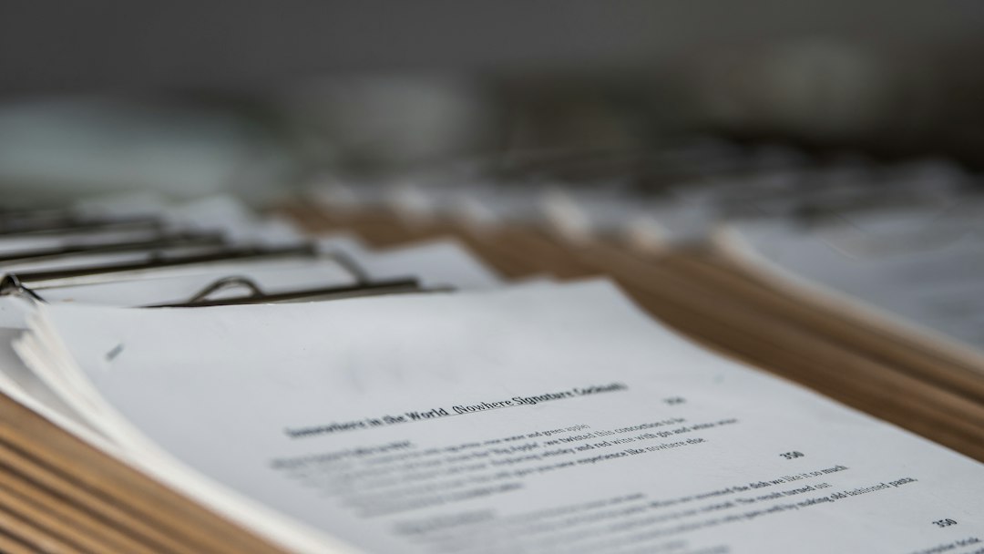Regulatory paperwork on a desk during an NHP ingredients database review
